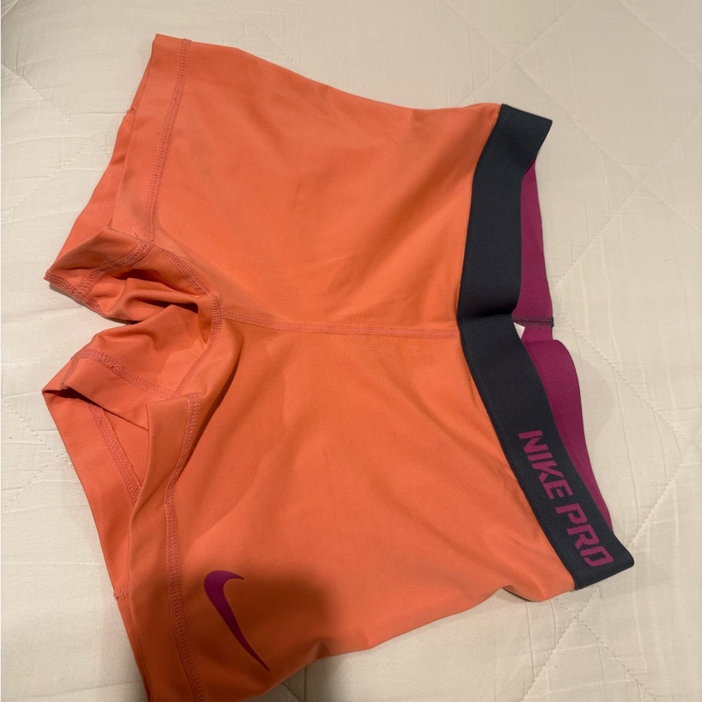 Nike Women's Pro Shorts in Orange and Pink